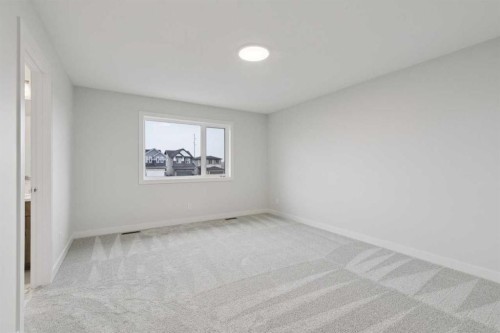 85 Southborough Square, Cochrane, AB - Indoor Photo Showing Other Room
