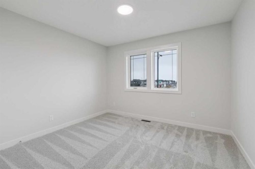 85 Southborough Square, Cochrane, AB - Indoor Photo Showing Other Room