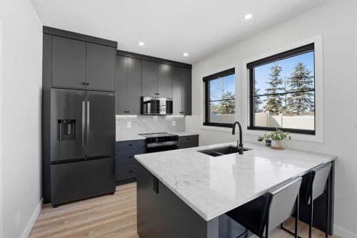 183 Ellington Crescent, Red Deer, AB - Indoor Photo Showing Kitchen With Stainless Steel Kitchen With Double Sink With Upgraded Kitchen