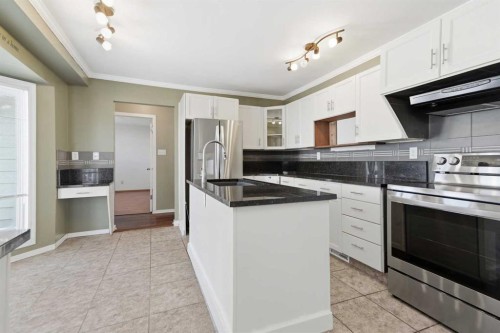 145 Wilson Crescent, Red Deer, AB - Indoor Photo Showing Kitchen With Upgraded Kitchen
