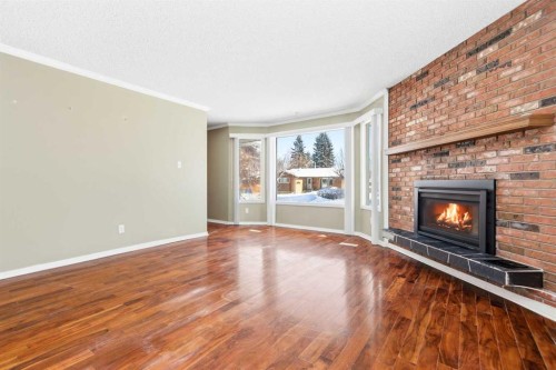 145 Wilson Crescent, Red Deer, AB - Indoor Photo Showing Living Room With Fireplace