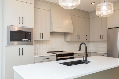 17 Tindale Place, Red Deer, AB - Indoor Photo Showing Kitchen With Double Sink With Upgraded Kitchen