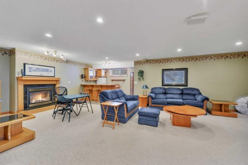 16 Askin Close, Red Deer, AB - Indoor Photo Showing Living Room With Fireplace