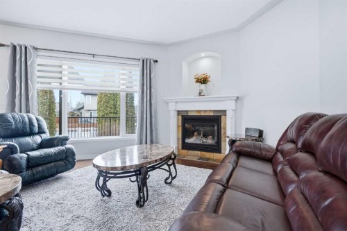 91 Woodrow Close, Red Deer, AB - Indoor Photo Showing Living Room With Fireplace