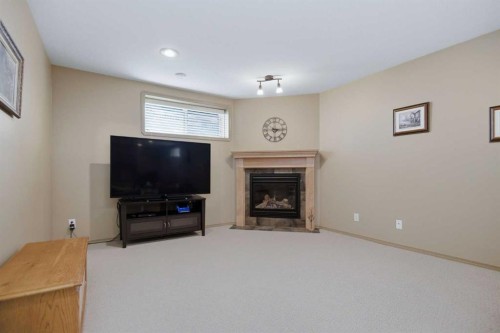 91 Woodrow Close, Red Deer, AB - Indoor Photo Showing Living Room With Fireplace
