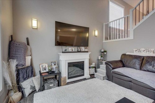 30 Tagish Avenue, Red Deer, AB - Indoor Photo Showing Living Room With Fireplace