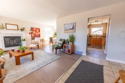 4 Barrett Drive, Red Deer, AB - Indoor Photo Showing Living Room With Fireplace