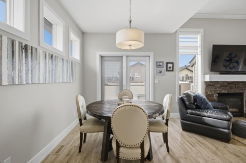 2 Vernon Close, Red Deer, AB - Indoor Photo Showing Dining Room With Fireplace