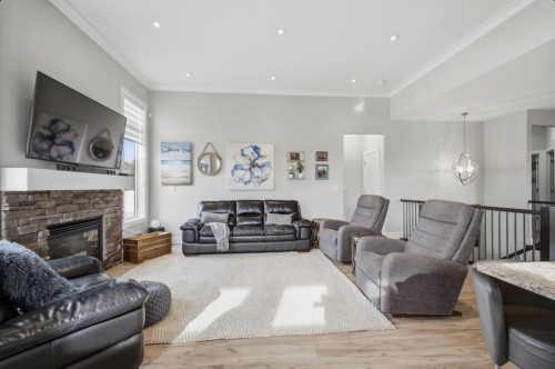 2 Vernon Close, Red Deer, AB - Indoor Photo Showing Living Room With Fireplace