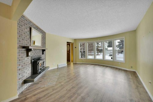37 Wilson Crescent, Red Deer, AB - Indoor Photo Showing Living Room With Fireplace