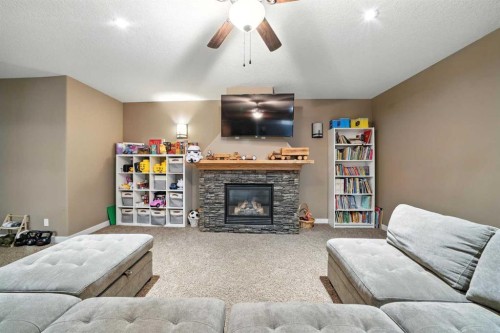 6511 57 Street, Olds, AB - Indoor Photo Showing Living Room With Fireplace