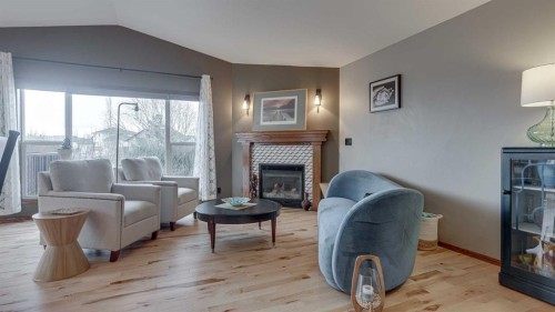 33 Parkside Crescent, Blackfalds, AB - Indoor Photo Showing Living Room With Fireplace