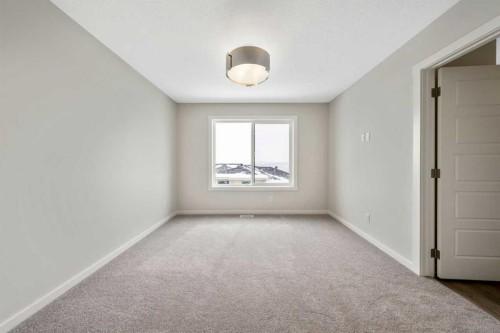 374 Heritage Boulevard, Cochrane, AB - Indoor Photo Showing Other Room