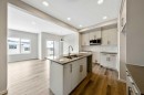 374 Heritage Boulevard, Cochrane, AB  - Indoor Photo Showing Kitchen With Double Sink With Upgraded Kitchen 