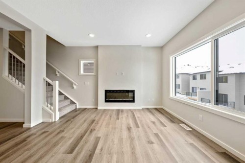 374 Heritage Boulevard, Cochrane, AB - Indoor With Fireplace
