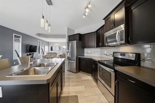77 Tanner Street, Red Deer, AB - Indoor Photo Showing Kitchen With Double Sink