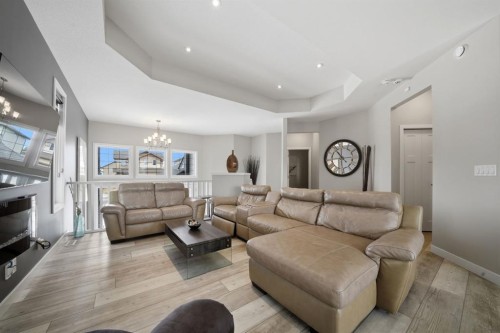 77 Tanner Street, Red Deer, AB - Indoor Photo Showing Living Room With Fireplace