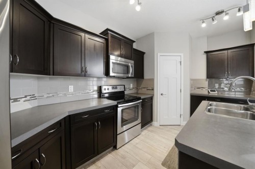 77 Tanner Street, Red Deer, AB - Indoor Photo Showing Kitchen With Double Sink