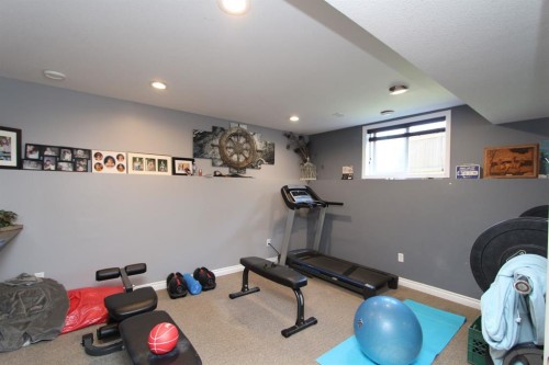 26 Wilkinson Circle, Sylvan Lake, AB - Indoor Photo Showing Gym Room