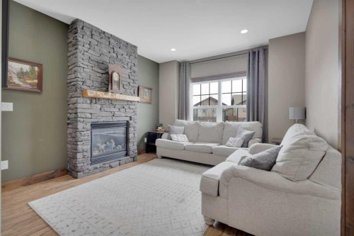16 Richfield Crescent, Sylvan Lake, AB - Indoor Photo Showing Living Room With Fireplace