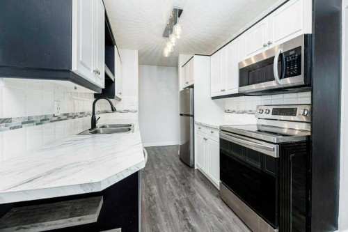 16-7 Stanton Street, Red Deer, AB - Indoor Photo Showing Kitchen With Double Sink