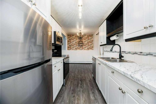 16-7 Stanton Street, Red Deer, AB - Indoor Photo Showing Kitchen With Double Sink