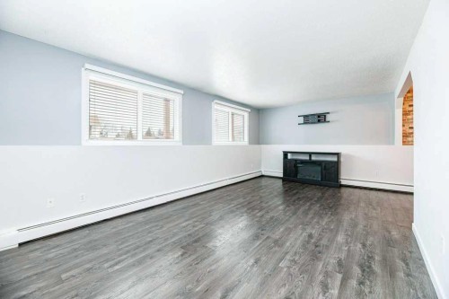 16-7 Stanton Street, Red Deer, AB - Indoor Photo Showing Living Room With Fireplace