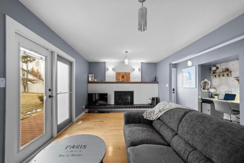 6911 42 Avenue, Camrose, AB - Indoor Photo Showing Living Room With Fireplace