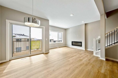 370 Heritage Boulevard, Cochrane, AB - Indoor With Fireplace