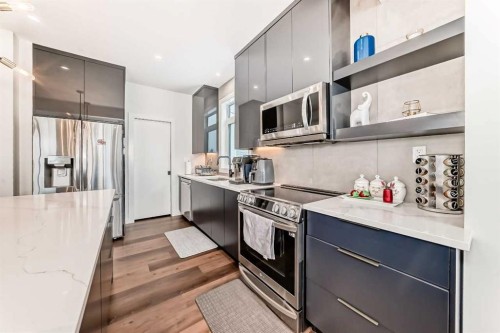 153 Emerald Drive, Red Deer, AB - Indoor Photo Showing Kitchen With Upgraded Kitchen