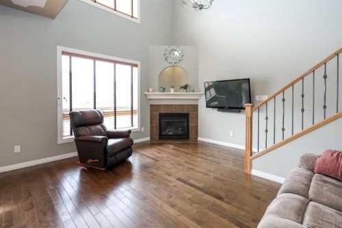 98 Pine Crescent, Blackfalds, AB - Indoor Photo Showing Living Room With Fireplace