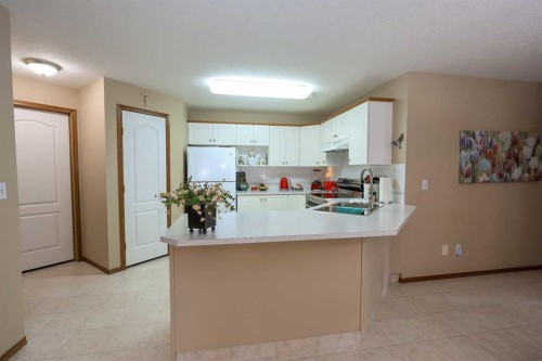 22D-32 Daines Avenue, Red Deer, AB - Indoor Photo Showing Kitchen With Double Sink