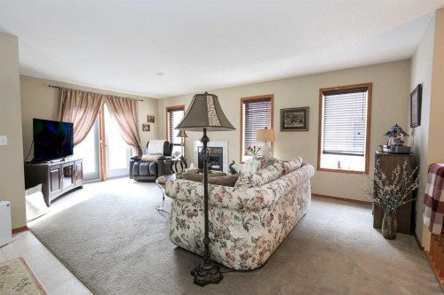22D-32 Daines Avenue, Red Deer, AB - Indoor Photo Showing Living Room With Fireplace