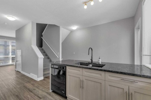 304-125 Caribou Crescent, Red Deer, AB - Indoor Photo Showing Kitchen With Double Sink