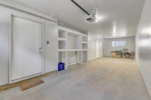 304-125 Caribou Crescent, Red Deer, AB - Indoor Photo Showing Garage