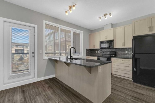 304-125 Caribou Crescent, Red Deer, AB - Indoor Photo Showing Kitchen With Upgraded Kitchen