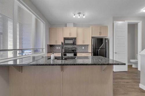 304-125 Caribou Crescent, Red Deer, AB - Indoor Photo Showing Kitchen With Upgraded Kitchen