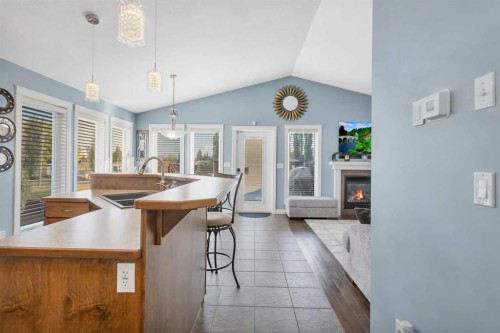 5 Heritage Drive, Penhold, AB - Indoor With Fireplace