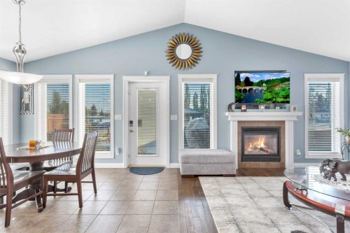 5 Heritage Drive, Penhold, AB - Indoor With Fireplace