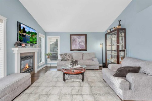 5 Heritage Drive, Penhold, AB - Indoor Photo Showing Living Room With Fireplace