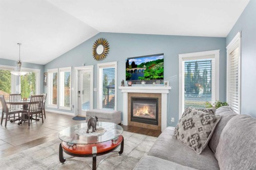 5 Heritage Drive, Penhold, AB - Indoor Photo Showing Living Room With Fireplace