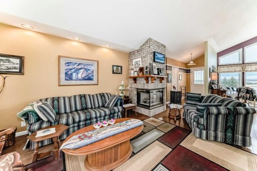 5205 55St., Rimbey, AB - Indoor Photo Showing Living Room With Fireplace