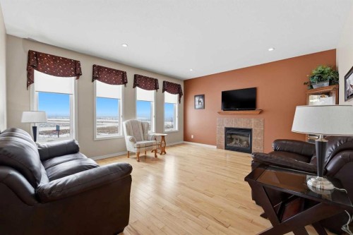 122 Sutherland Close, Red Deer, AB - Indoor Photo Showing Living Room With Fireplace