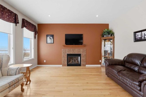 122 Sutherland Close, Red Deer, AB - Indoor Photo Showing Living Room With Fireplace