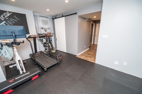 75 Doherty Close, Red Deer, AB - Indoor Photo Showing Gym Room