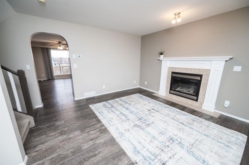 75 Doherty Close, Red Deer, AB - Indoor Photo Showing Living Room With Fireplace