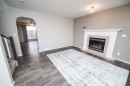 75 Doherty Close, Red Deer, AB  - Indoor Photo Showing Living Room With Fireplace 