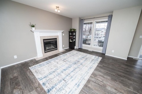 75 Doherty Close, Red Deer, AB - Indoor Photo Showing Living Room With Fireplace