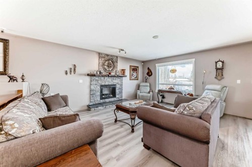 232 Deschner Close, Red Deer, AB - Indoor Photo Showing Living Room With Fireplace