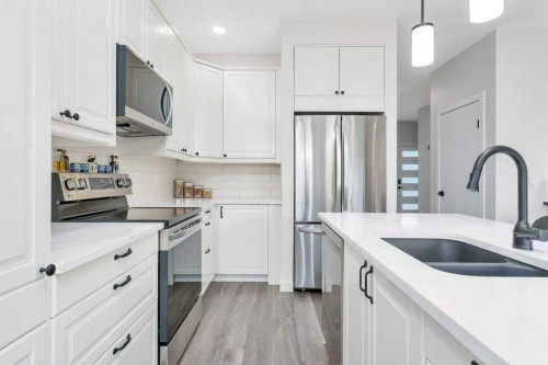 26 Athens Place, Blackfalds, AB - Indoor Photo Showing Kitchen With Stainless Steel Kitchen With Double Sink With Upgraded Kitchen
